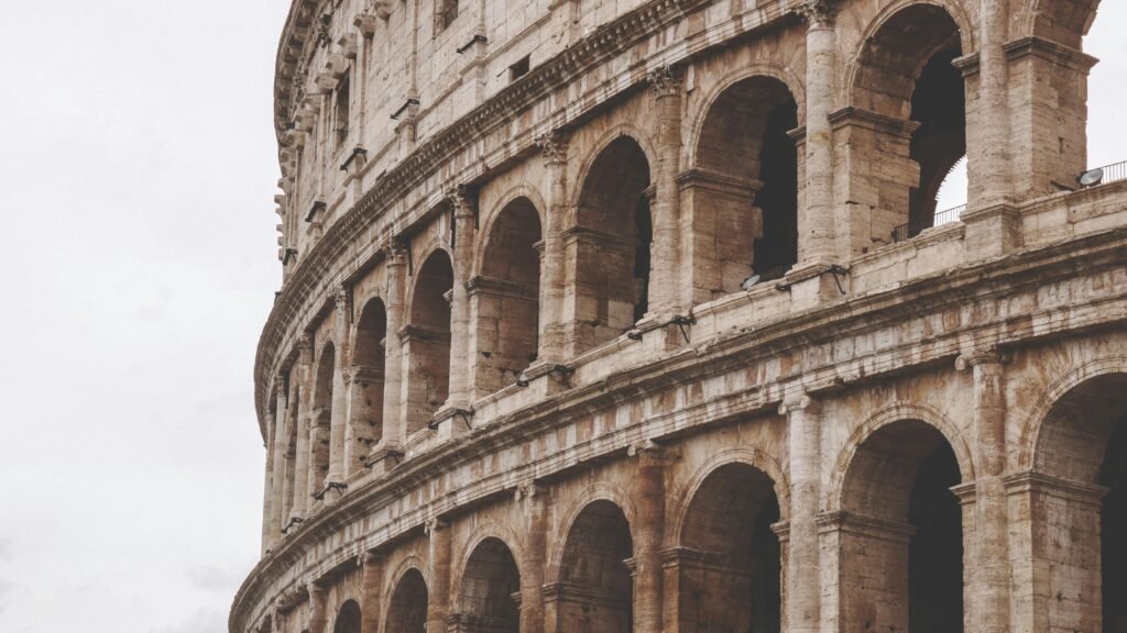 rome-ancient-italy-landmark-161858-161858 Detailed view of the ancient Colosseum arches in Rome, showcasing historic architecture.